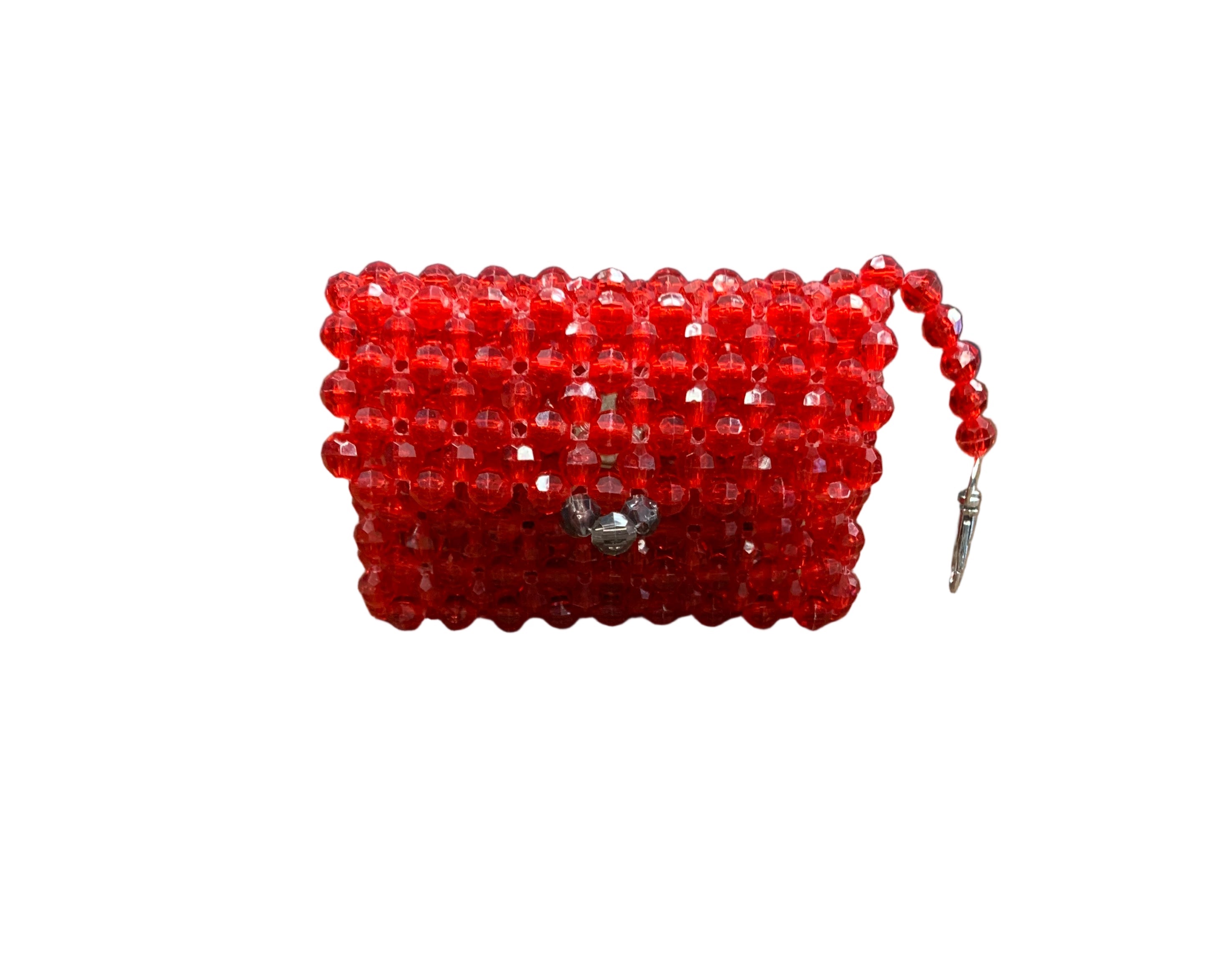 Red beaded pouch on a wooden surface
